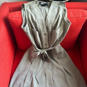 Green dress with bow front detail, pockets and sleeveless